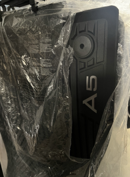 New genuine Audi A5 front and rear rubber mat set with A5 logo on front mats